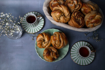 cup of coffee and cinnamon buns