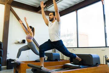 Pilates reformer workout with instructor