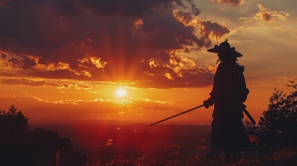 Samurai warrior silhouette with katana sword during sunset. Scenic landscape with dramatic clouds and radiant sunlight