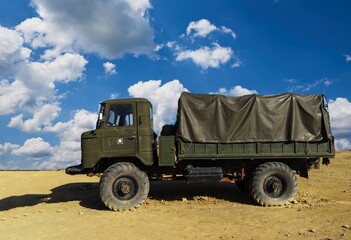 Obraz premium A damaged military truck on the battlefield. military technics.