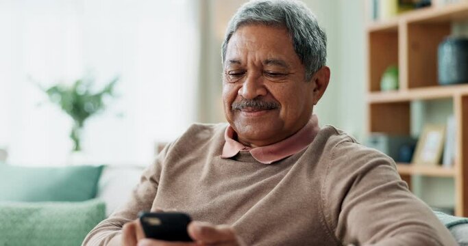 Phone, communication and senior man on sofa with smile, online chat and scroll on internet in home. Connection, networking and happy old person on couch with smartphone for mobile app, news or typing