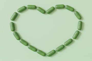 Herbal capsules forming a heart shape on a light green background, a creative display for wellness and natural supplement concepts. Homeopathy. Copy space for text. 3D render.