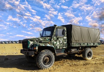 Obraz premium A damaged military truck on the battlefield. military technics.