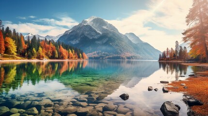 A serene lake reflecting the stunning hues of autumn trees and the majestic mountain in the background - obrazy, fototapety, plakaty