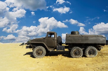 Obraz premium A damaged military truck on the battlefield. military technics.