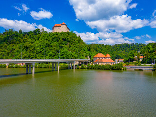 Obraz premium Rajhenburg castle overlooking Brestanica village and Sava river in Slovenia