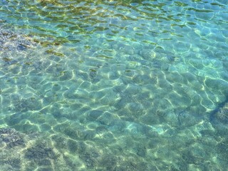 Fototapeta na wymiar Transparent sea water with algae at the bottom.