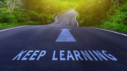 Self development concept and changing skill demand idea, Keep Learning and arrow written on asphalt...