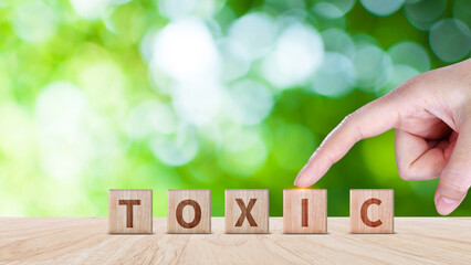 Toxic concept, Cubes wooden blocks form the word Toxic. extensive Toxic Concept applies to both...