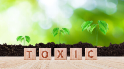 Toxic concept, Cubes wooden blocks form the word Toxic. extensive Toxic Concept applies to both...