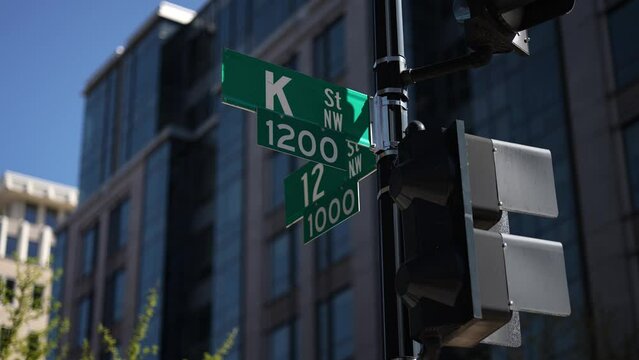 K street nw and 12th street nw street signs in downtown Washington DC symbolizing lobbying and corruption in nations capital