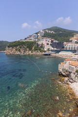 Fototapeta na wymiar View of seaside by Adriatic Sea with Ricardova Glava Beach located at the City Walls, Budva, Montenegro