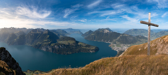 Lake in a valley seen from Fronalpstock summit in Switzerland. Swiss Alps iconic panorama