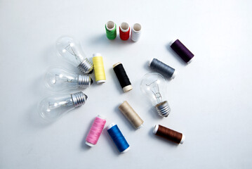 Spools of thread and light bulbs	