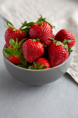 Organic Red Strawberries in a Bowl, side view.