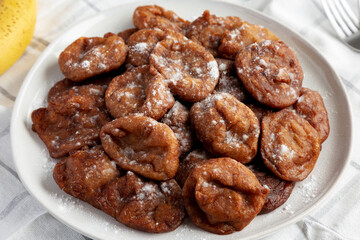 Homemade Banana Fritters on a Plate, side view.