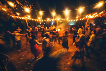A group of people dancing joyously in a circle, during the night with festive string lights twinkling overhead. A cultural festival. Blurred, out of focus.