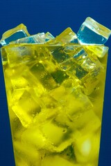 Golden Inca Kola Soda Glass with Ice on Blue Background in 4K Image