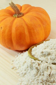 Autumn Essentials: Close-Up of Pumpkin and Flour in 4K Image