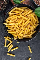 tortiglioni raw pasta cooking appetizer meal food snack on the table copy space food background rustic