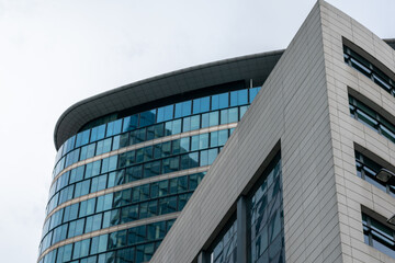 High-rise building in Brussels, Blue glass background office building texture,glass skyscraper background,building with glass windows.