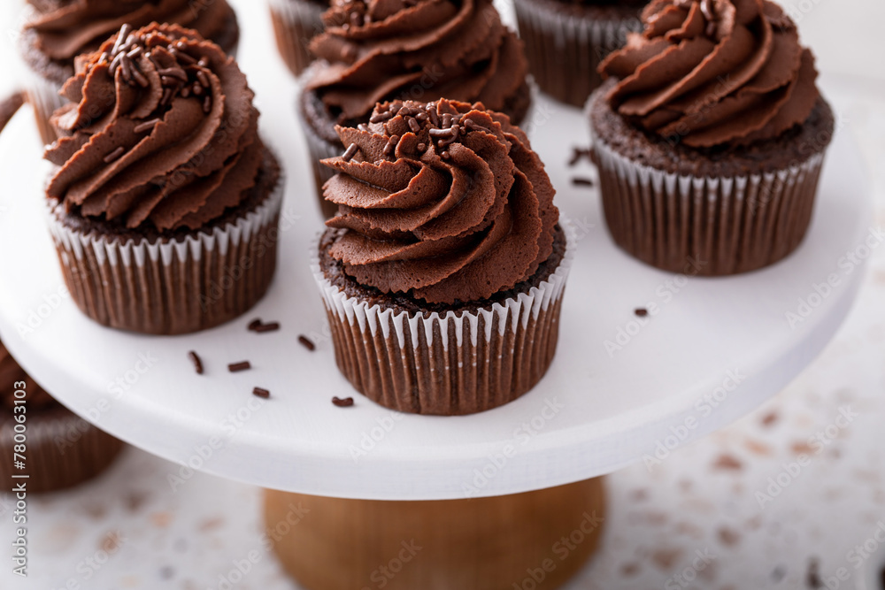 Wall mural Chocolate cupcakes with chocolate ganache frosting and chocolate sprinkles