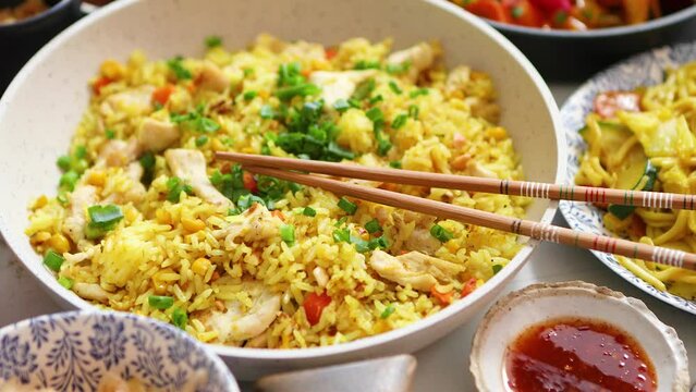 Delicious Chinese Fried Rice with Chopsticks and Sauce
