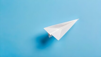 Fototapeta premium Paper Plane Flying Across Blue Background: Creative Imagination, Symbolic Journey, and Aerodynamic Design