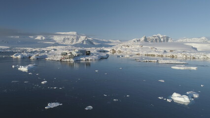 Drone View of Antarctic Science Station - Vernadsky Base. Ocean Coast Open Water Surface. South...