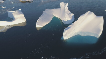 Iceberg Melt in Clear Ocean Drone Top Down View. Huge Snow Ice Float in Sea, Global Climate Change...