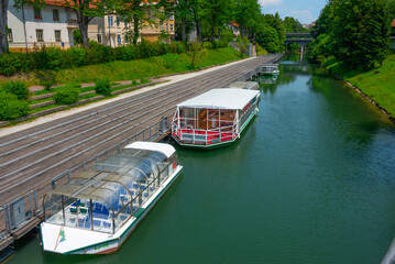 Tourist boats cruising Ljubljanica river in the Slovenian capita