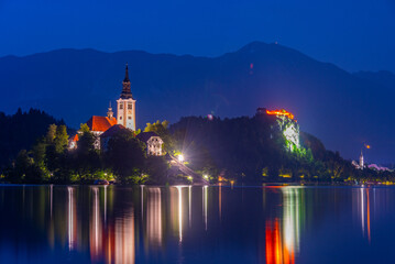 Night view of the Assumption of Maria church and Bled Castle at lake Bled in Slovenia
