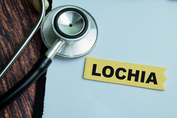 Concept of Lochia write on sticky notes with stethoscope isolated on Wooden Table.