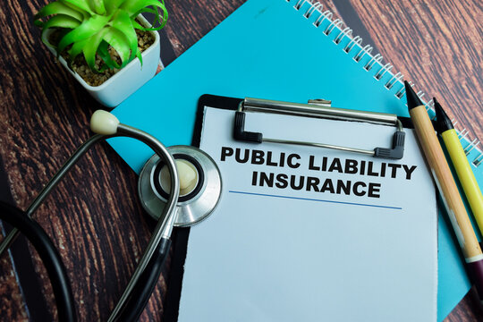Concept of Public Liability Insurance write on paperwork with stethoscope isolated on wooden background.