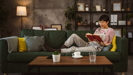 one female mature japanese woman read book at home