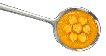 Chickpea cream soup in spoon isolated on white background, top view