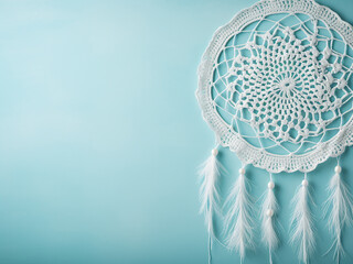 Copy space available on aquamarine textured background with white dream catcher - obrazy, fototapety, plakaty