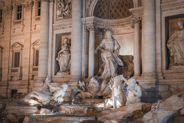 Trevi Fountain, Rome, Italy illuminated Baroque masterpiece with intricate sculptures, towering...