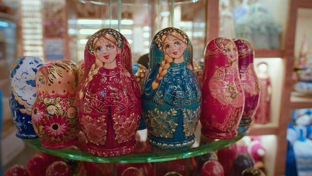Matryoshka Dolls. Souvenirs Display Of Shop. Classic nesting dolls in traditional Russian clothes. Created of wood and richly painted Russian folk souvenirs are very beautiful and shine with brightly