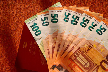 euro banknotes on a red background