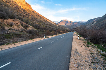 Asphalt road surrounded by mountains, natural luxury picture, travel concept, stock photo