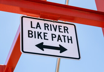 LA River Bike Path sign on metal bridge structure with two way arrow.   - obrazy, fototapety, plakaty