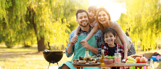 Happy family having picnic on summer day - obrazy, fototapety, plakaty