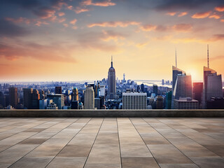 Sunset casts a glow over an empty concrete rooftop against the iconic New York City skyline
