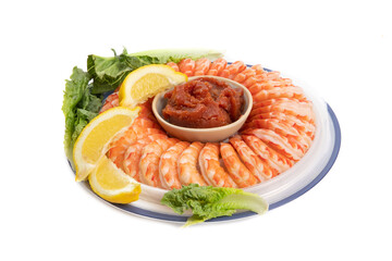 a Black Tiger cocktail shrimp ring with tomato cocktail sauce and lemon slices garnished with...