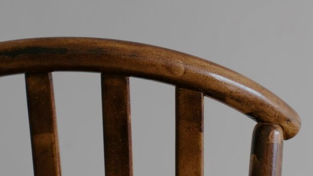 Restoration of a wooden chair. Covering with dark varnish. Close-up. Vintage things. High quality 4k footage
