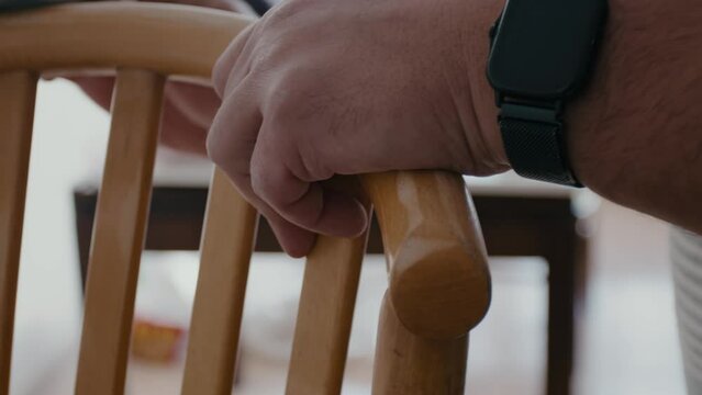 Restoration of a wooden chair. Close-up. Vintage things. Using sandpaper to restore old wooden furniture slow motion. High quality 4k footage