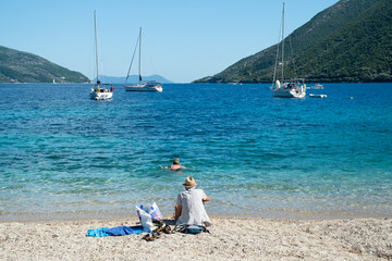 Fototapeta na wymiar Tourists enjoying the beach in Greece