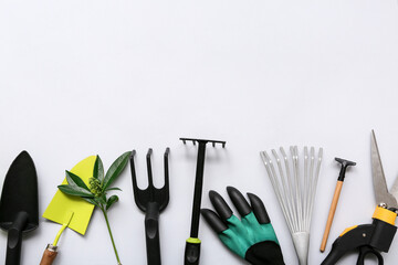 Gardening tools on white background. Top view