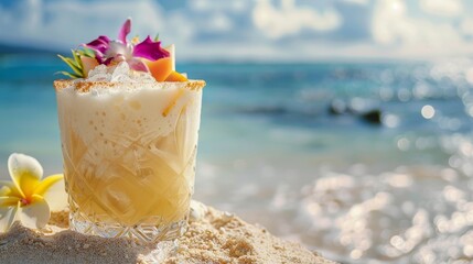 Close-up of a rustic pina colada, fresh fruit crowning the glass, sandy beach and a solitary exotic flower beside - obrazy, fototapety, plakaty